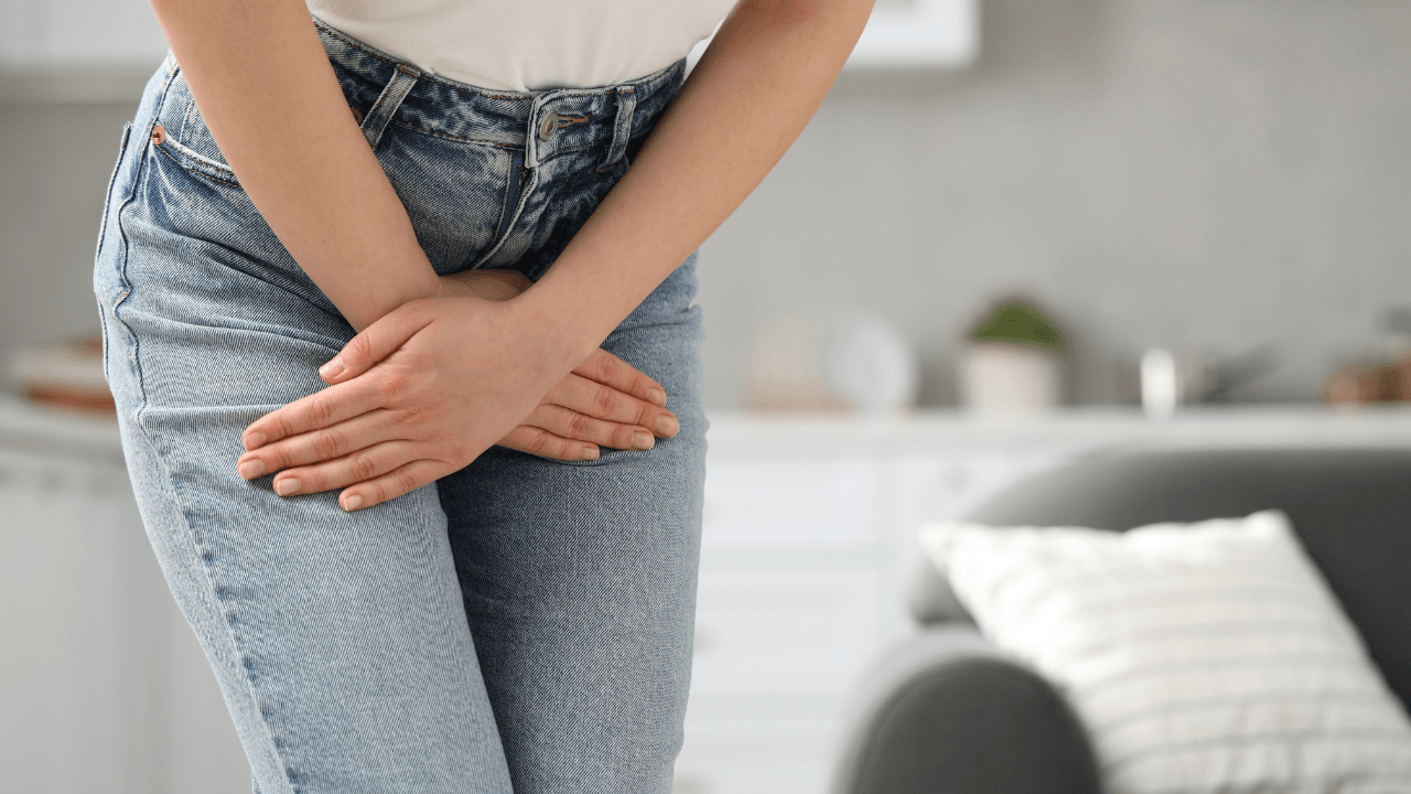 Woman showing signs of discomfort from symptoms of atrophic vaginitis such as vaginal dryness, burning, or itching.